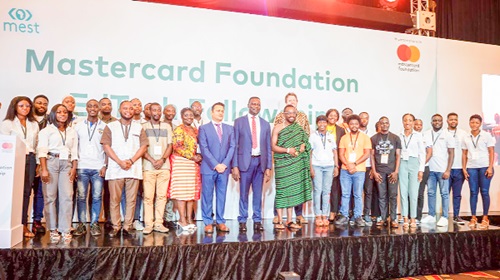 Dr Yaw Osei Adutwum (arrowed), Minister of Education, with some dignitaries and the first cohort of the Mastercard Foundation EdTech Fellowship at the launch
