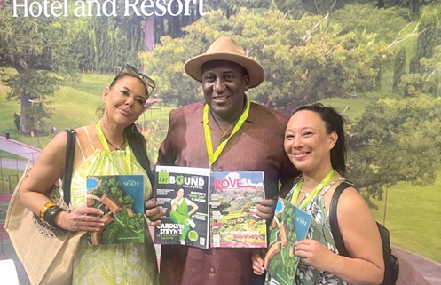Emmanuel Mensah (middle), Sales and Marketing Manager, Royal Senchi Hotel and Resort, and some potential buyers displaying some magazines