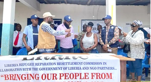 Jeddi Armah, Liberia’s Deputy Minister of Legal Affairs (3rd from right), addressing the refugees at Buduburam, during his visit