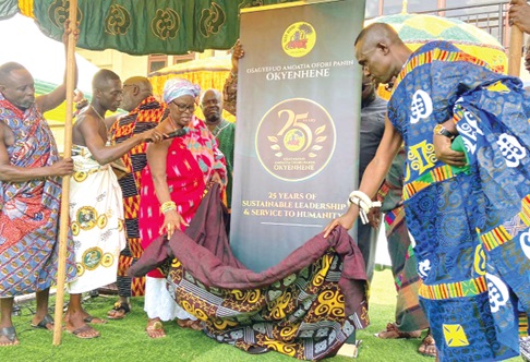 Nana Adutwumwaa Dokua (3rd from left), Okyenhemaa, and Dr Asumadu Nyarko Appiah (right), Chief of Akyem Wenchi, unveiling the 25th anniversary logo at Kyebi 