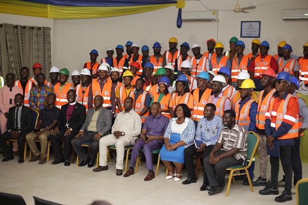 The graduates with the school's officials and dignitaries 
