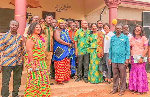 Helen A. Fosu (4th from right) and Prof. Augustin Fosu (5th from right), her husband, with some of the dignitaries in front of the library after the handover