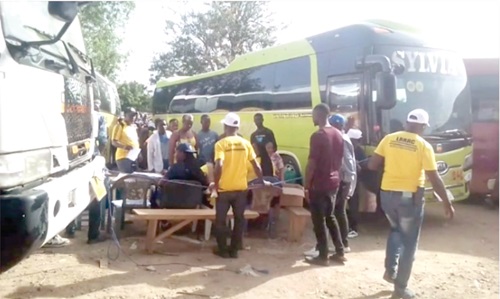 Some of the Liberians preparing to board the bus