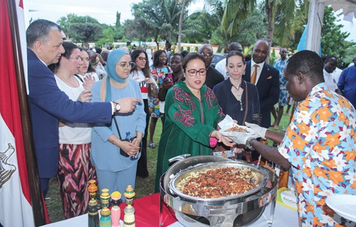 Imane Ouaadil (3rd from right), Dean of the African Group of Ambassadors, being served an Egyptian dish at the food bazaar section of the AU Day celebration in Accra. Looking on are other African diplomats Imane Ouaadil (3rd from right), Dean of the African Group of Ambassadors, being served an Egyptian dish at the food bazaar section of the AU Day celebration in Accra. Looking on are other African diplomats