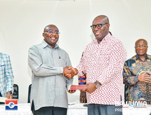 Dr Anthony Yaw Baah (right), Secretary-General of the TUC,  presenting 10 copies of the TUC manifesto to Dr Mahamudu Bawumia, the Vice-President 