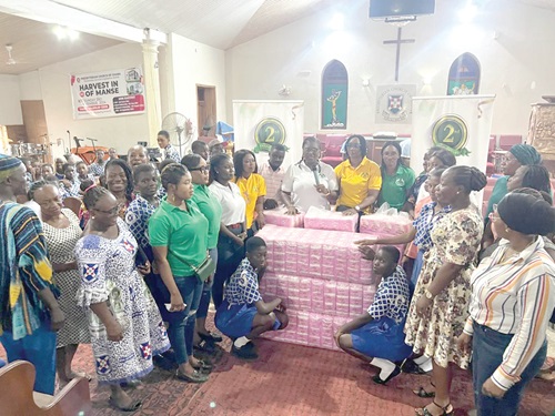 Iris Obeng-Tuudah (arrowed), President of ARB Apex Bank Ladies Association, presenting the sanitary pads to the schools. With her are some members of the association