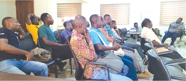 An official of the ECG (right) interacting with the meter readers