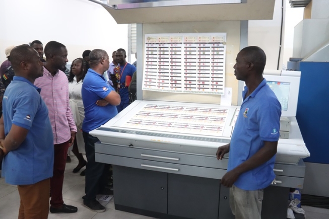 Dr Eric Bossman Asare (middle), Deputy EC Commissioner, explaining electoral ballot printing process during a visit to the printing facilities. Picture: ELVIS NII NOI DOWUONA 