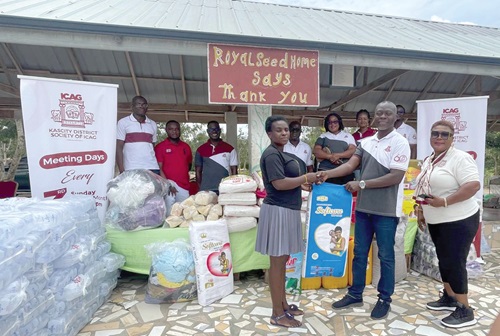 Esther Sakyi (left), Senior Caretaker at the Royal Seed Home, receiving the items from Joshua Lomotey, Chairman of the Kascity District Society of the Institute of Chartered Accountants, Ghana