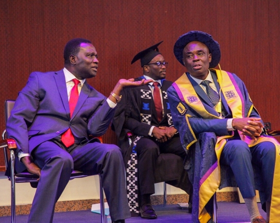 Graduates and faculty members at the fourth session of the 16th Congregation of the UPSA. Inset: Dr Yaw Osei Adutwum (left), Minister of Education, in a conversation with Abednego Feehi Okoe Amartey (right), Vice-Chancellor of UPSA