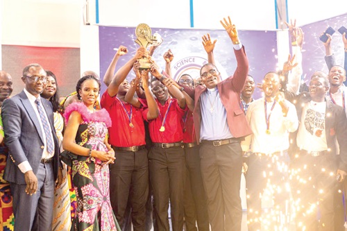  The Mfansipim boys raised the trophy in jubilation. With them include Prof. Elsie Effah Kaufmann (2nd from left), the Quiz Mistress, and some school authorities
