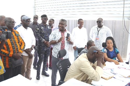  Dr Eric Bossman Asare (middle), Deputy EC Commissioner, explaining the electoral ballot printing process during a visit to the printing facilities. Picture: ELVIS NII NOI DOWUONA 