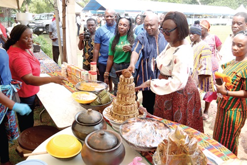 Paul Siameh (2nd from right), Chief Director, Ministry of Food and Agriculture, and Marian Kpakpa (right), Chief Director, Ministry of Fisheries and Aquaculture Development, admiring a cake made from local plantain. Picture: ELVIS NII NOI DOWUONA 