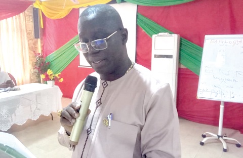 Dr Samuel K. Boakye-Boateng (right), Upper East Regional Director of Health Services, addressing the meeting