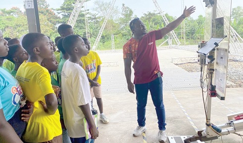 Raphael Tene, the Flight Operations Leader at Omenako centre, taking the pupils through the various stages the drones go through from departure to arrival at the centre