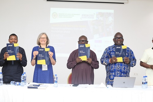 Professor Abdulai Abdul-Gafaru (left), University of Ghana, Diana Braima (2nd from left), CEO, African Cities Research Consortium, Osei Bonsu Amoah (2nd from right), Minister, Ministry of Local Government, Decentralisation and Rural Development, and Professor Nana Obeng Ababio (right), University of Ghana, launching the Accra City Synthesis report. Picture: BENEDICT OBUOBI