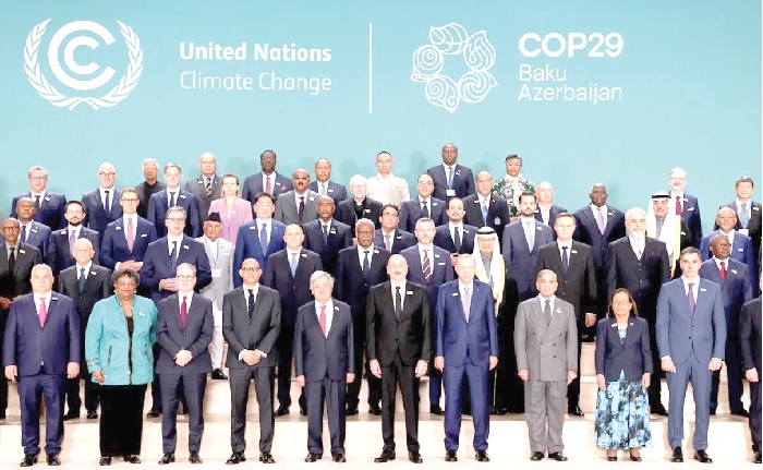 World leaders and delegations pose for a family photo on day two of the COP29 talk