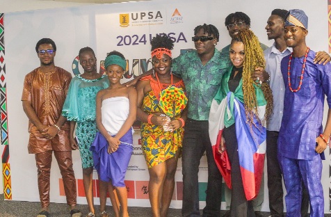 .Stonebwoy (middle), musician, with the international students in celebration of the dayPicture: CALEB VANDERPUYE