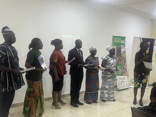  Paulina Addy (right), Executive Director, Women in Agriculture Directorate, launching the two policy briefs