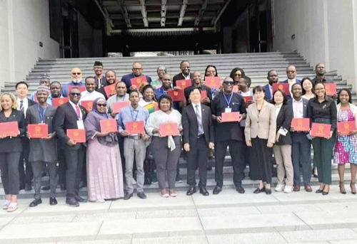 Participants in the training programme displaying their certificate of participation