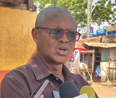  Banini Dzorgbenyui —Municipal Coordinating Director, Ashaiman, explaining a point to journalists in an interview