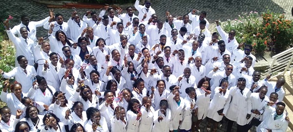 The medical students robed in white clinical coats to begin their clinical studies