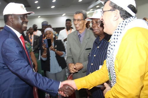 Raila Odinga (left), a former Prime Minister of Kenya, exchanging pleasantries with Arezki Mezhoud (right), the Secretary General of OATUU, and Dr Francis Atwoli (2nd from right), the President of the organisation. Picture: Nana Konadu Agyeman