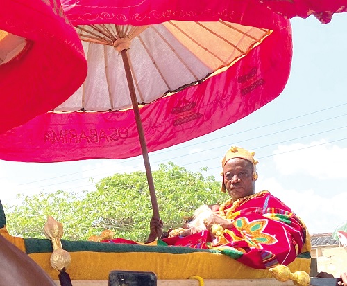 Osabarima Dr Owusu Beyeeman, Chief of Akyem Muoso, being carried in a palanquin to a durbar held to mark his one year on the throne