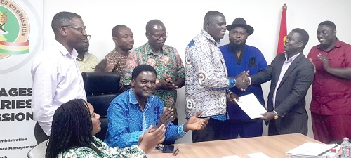  Dr Cephas Akortor (4th from right) receiving the signed agreement from Prof. Charles Oppong