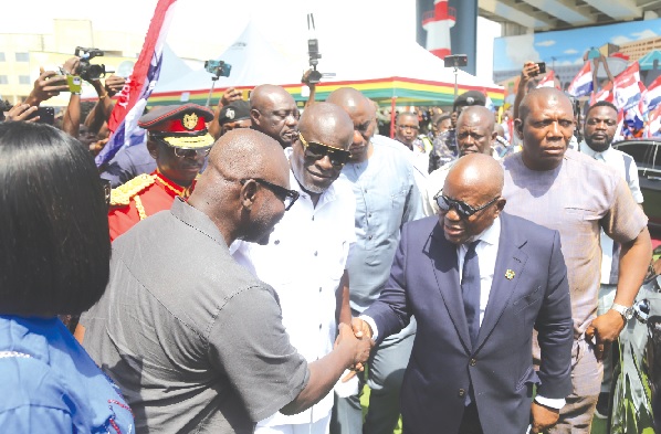 President Akufo-Addo (in suit) being welcomed by Francis Asenso-Boakye (back to camera), Minister of Roads and Highways, for the inauguration of the Obetsebi Lamptey Interchange at Abossey Okai in Accra. Picture: SAMUEL TEI ADANO