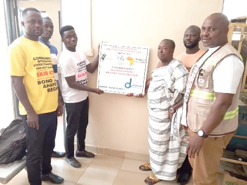 Isaac Kwabena Kakpeibe (right), Executive Director of TAAG, Gabriel Kwadwo Manu (2nd from right), Health Committee Chairman, Debibi Traditional Council, and Philip Yeboah (left), Tain District Officer of Disease Control, at the inauguration of the Centre