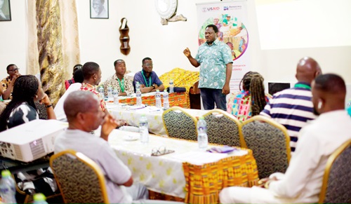 Charles Yao Mawusi (standing) interacting with the media practitioners during the workshop