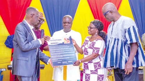  Dr Shine Agatha Ofori (2nd from right), retired Headmistress of WASS, receiving a citation from Nii Addokwei Moffatt (2nd from left, partly covered), the Board Chairman of the school. Looking on is Very Rev. Dr Setorwu Kwadzo Ofori (left), the husband of Dr Mrs Ofori, Stephen Abamfo (3rd from left), the Greater Accra Regional Director of Education, and Prof. Clement Somuah, an old student  