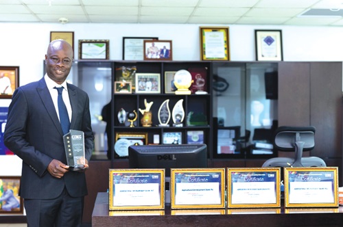  Alhaji Alhassan Yakubu-Tali  — Managing Director of ADB PLC, displaying one of the awards 