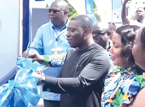 Herbert Krapa (2nd from left), the Minister of State at the Ministry of Energy, being assisted by Egbert Faibille Jnr (left), CEO, Petroleum Commission, and other dignitaries to open the conference