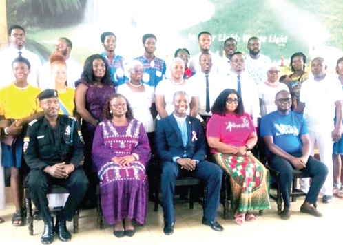 Frank Spencer Forson (seated right), Diocesan Vice-Chairman, YDM; Lucille Hewlett Annan (seated 2nd from right), Secretary, NCCE; Dr Afua Boatemaa Yakohene (seated 2nd from left), member, Greater Accra Regional Peace Council, and Chief Inspector Samuel Kaledzi (seated left), Kaneshie Divisional Command, with other participants in the launch