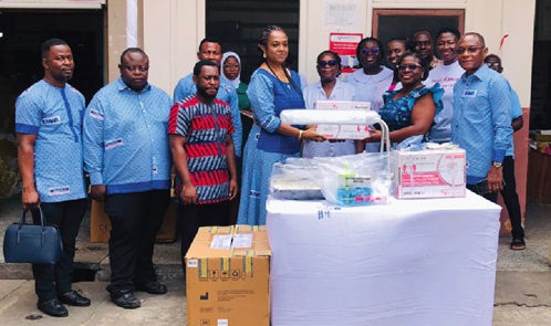  Yasmin Essifie Mensah (4th from left), MD, Edward Mensah Wood &amp; Associates Ltd, presenting the medical equipment to Dr Margaret Neizer, Head of Clinical Services at the hospital.