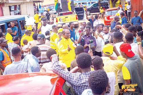  Alan  Kyerematen (arrowed) interacting with residents of Drobonso during the tour
