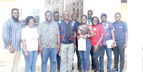  Mordecai Quarshie (middle), the MCE of LEKMA, and Jacob Johnson Attakpah (3rd from left), the Zero Waste Cities Manager, with officials of GAYO after the two parties signed the MoU