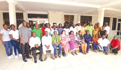 Nana Afua Ababio (seated 2nd from right), Administrator of E-waste Fund, Dr Freda Prempeh (seated 3rd from right), Member of the Parliamentary Select Committee on Environment, with the workshop participants in Koforidua