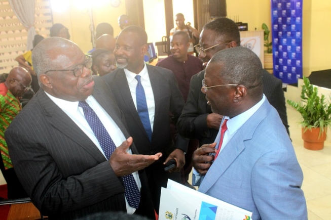  Dr Mohammed Amin Adam (right), Minister of Finance and Economic Planning, interacting with Emeritus Prof. Ernest Aryeetey (left), Economist and former VC, UG. Looking on are other dignitaries. Picture: ERNEST KODZI