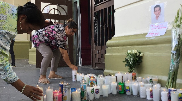 Supporters of slain Mayor Alejandro Arcos place candles and flowers at the entrance of the municipal building in Chilpancingo, Mexico, Oct. 7, 2024