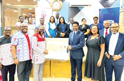  Ben Mensah (3rd from right), Head of Personal and Private Banking, Stanbic Bank Ghana, presenting the medical equipment to Dr Frank Serebour (3rd from left), President, GMA. With them are officials of GMA and the bank