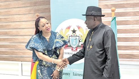  Jean Adukwei Mensa (left), the EC Chairperson, in a handshake with Goodluck Jonathan, former Nigerian President