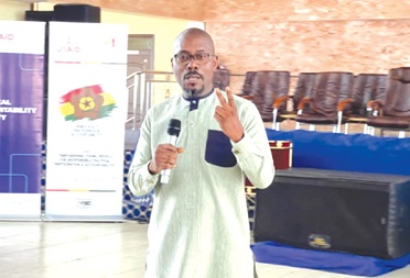 Mawuli Agbenu (right), the Greater Accra Regional Director of NCCE, addressing the participants in the forum     
