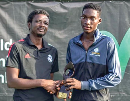 Prosper Ikenno Okonkwo (right), receving his award
