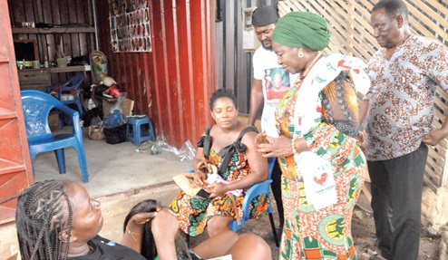 Nana Akosua Frimponmaa Sarpong-Kumankumah (2nd from right), the CPP Presidential Candidate, interacting with some residents at the Ho New Housing during her campaign tour