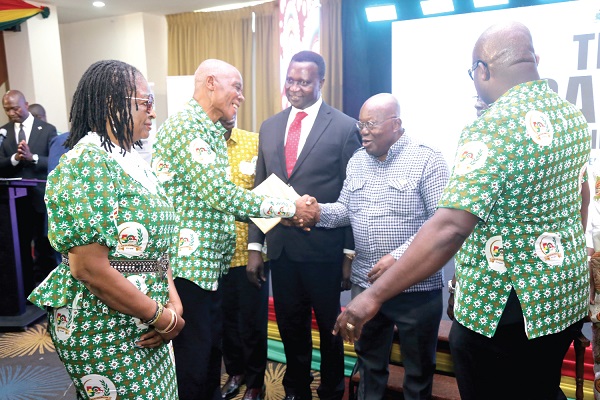 President Akufo-Addo exchanging pleasantries with some of the former executives of the National Service Scheme after the launch of the National Service Authority in Accra. Picture: SAMUEL TEI ADANO
