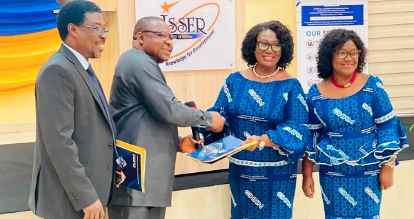 Prof. Sandow Mark Yidana (2nd from left) exchanges signed MoU documents with  Florence Hutchful (2nd from right), while Dorothy Asare, Vice-President Elect of CIHRM, and Prof. Justice N. Bawole, Dean of UGBS, look on 
