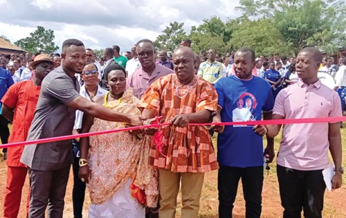 Kwabena Adjei Asante (in smock), DCE for Juaboso, with Peter Mensah (left), CEO of PM Group of Companies, and traditional leaders commissioning the water project